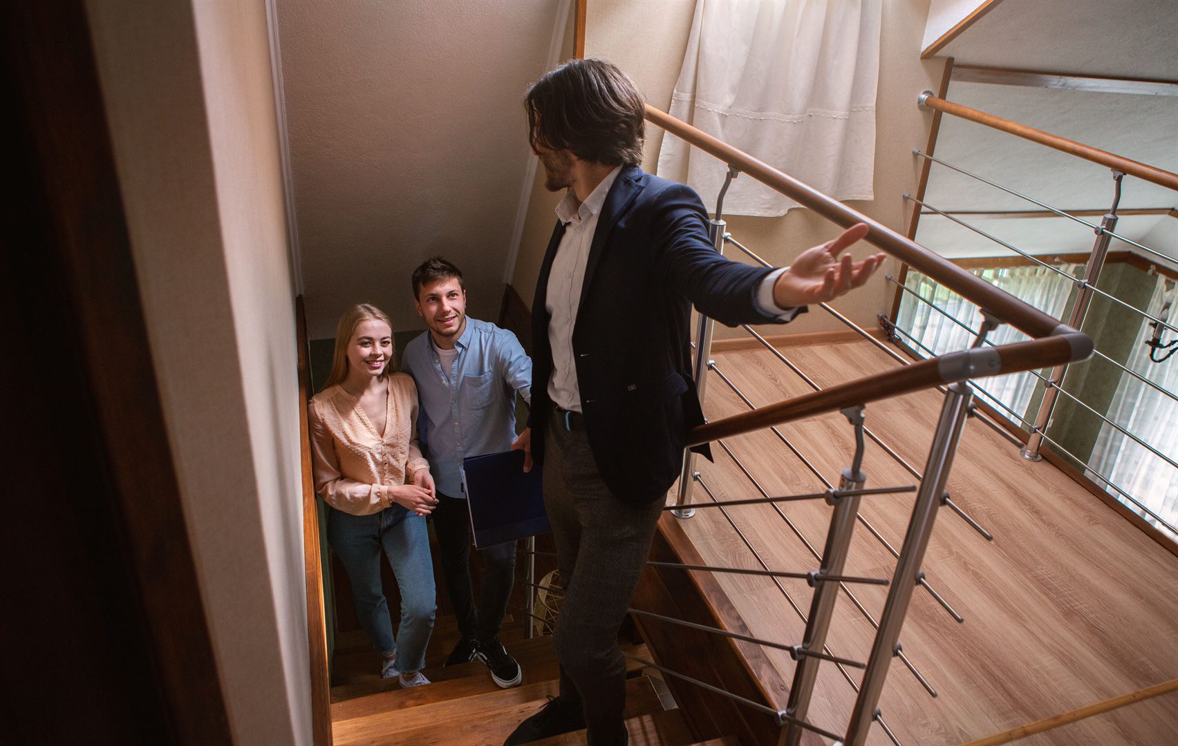 real-estate-agent-showing-prospective-buyers